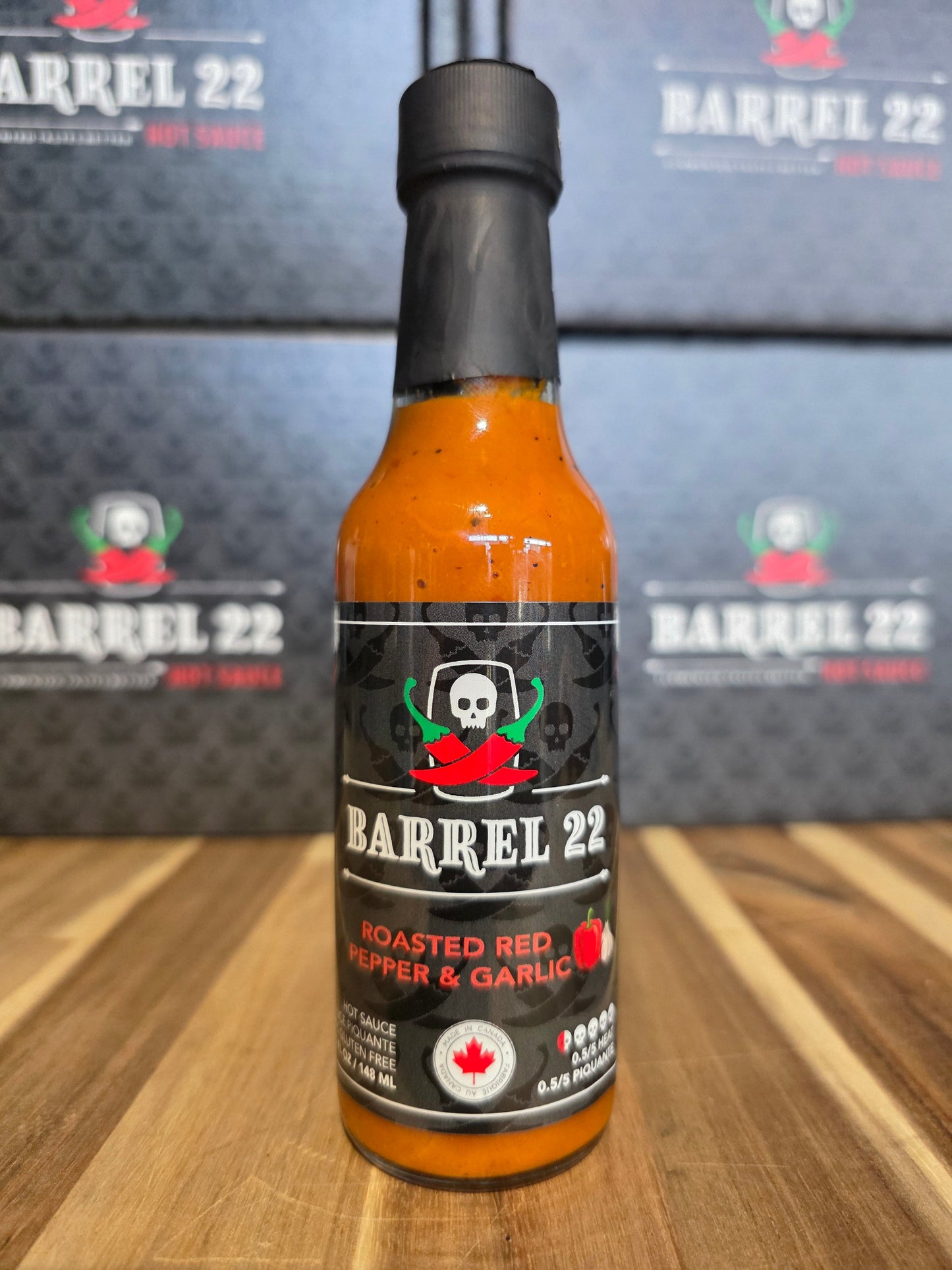 Barrel 22 hot sauce bottle on a wooden surface with blurred background